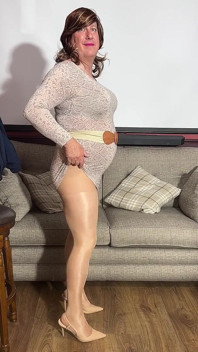 Sissy Crossdresser in Tan Pantyhose Using Her Magic Wand