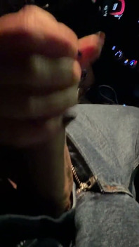 Risky Car Handjob While Driving Through the City