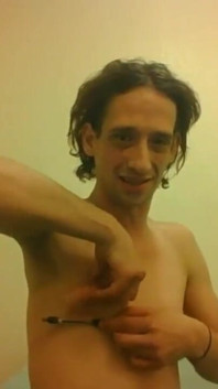 Topless Transgirl Trying to Hold a Pen W/her Tiny Boobs