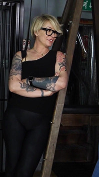 Slave Mila's Feet Dangle and Quiver as Mistress Baton Breaks in Heavy Wooden Paddle Over Her Jeans and Bare