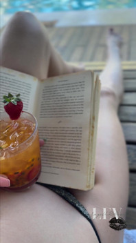 Reading by the Pool in a Bikini That Barely Counts as Spf
