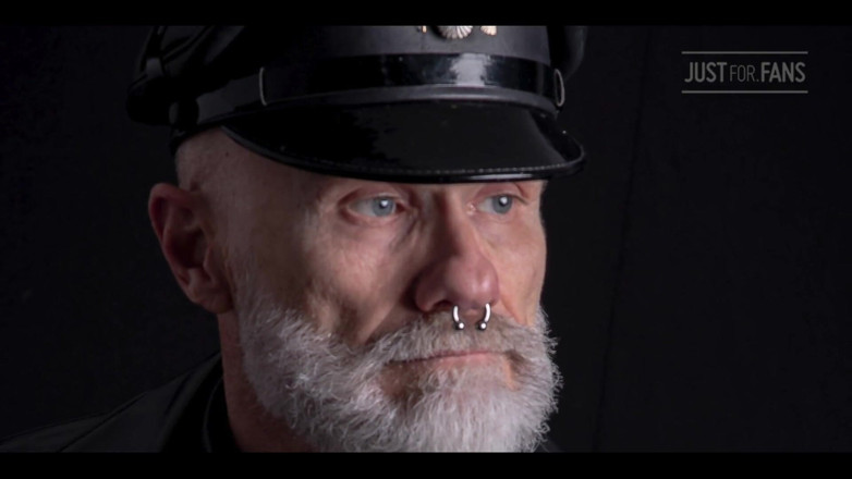 Dominique X: Stepdad lighting his Cigar in rubber apron