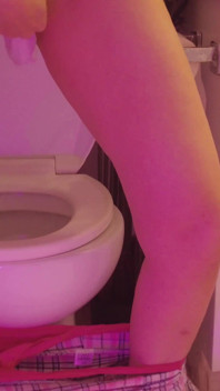 Emily pissing in the bathroom