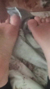 Playing with Friends Soles, While She's Reading.