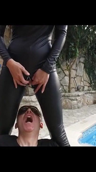 Blackhaired Domina in Latex Pissed Man in Mouth, Then He Licks Her After He Is Fucked Hard with a Strapon and Eats His Own Cum