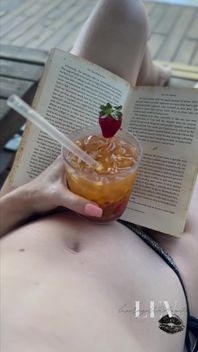 Reading by the Pool in a Bikini That Barely Counts as Spf