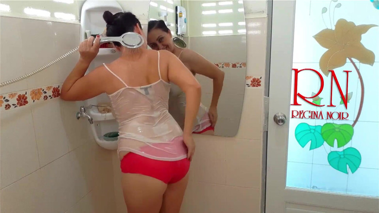 Regina Noir: The girl bathes in a shower in a T-shirt and...