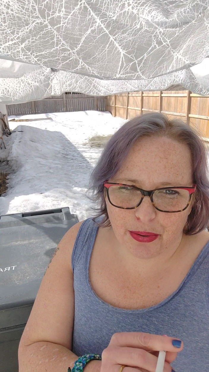 AngYourDirtyCanadian: Calm Outdoor Smoking Moment with a Playful Lipstick Look