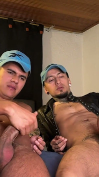 Two Males Emptying Their Balls in a Glass, Ready to Drink Their Own Juices