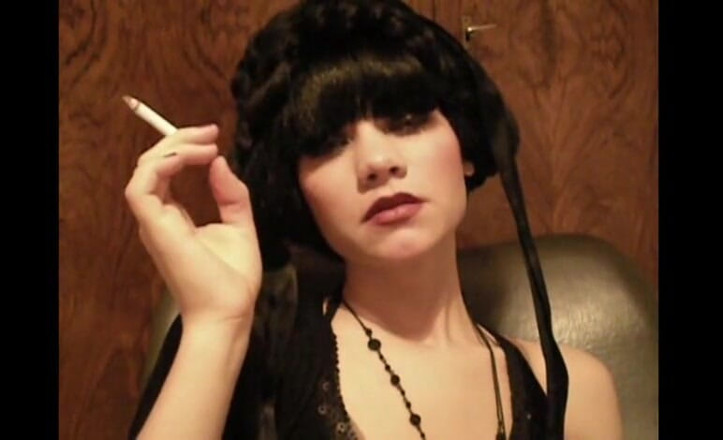 Femdom Austria: Glamorous beauty smoking a cigarette