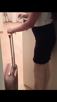 MILF in Stockings and Heels Walks Through the Corridors of a Hotel