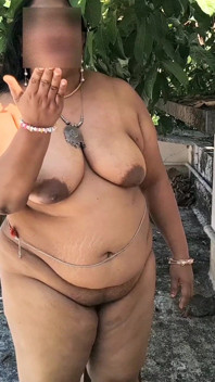 India Curvy Girl in White Jacket Strips for the Camera