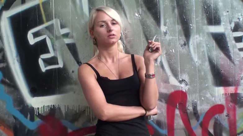 Femdom Austria: Lovely blonde teen smoking a cigarette outdoors