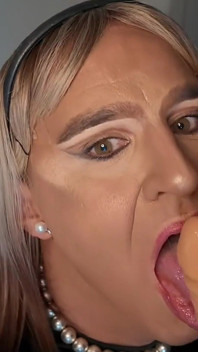 Crossdresser Sucks Dildo