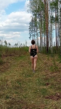 Pretty Woman Walking Through the Forest Showed Her Ass