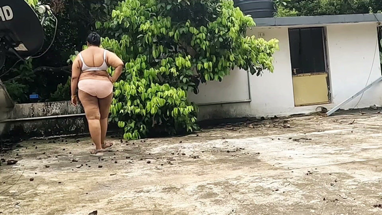 Anne Ipe: A Full-figured Woman in a White Skirt and Pink Top...