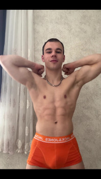 Cute Athlet Boy Showing Muscle