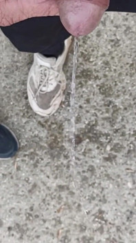 Friend Is Holding My Cock While Im Peeing on the Ground Outdoor
