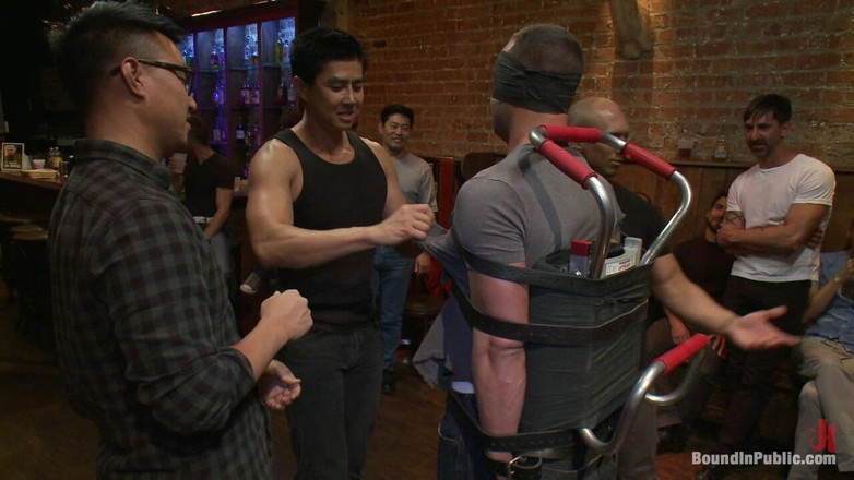 Bound in public: Italian Bodybuilder Is Used and Humiliated at a Public Bar.