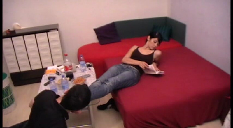 Femdom Austria: Licking feet by the coffee table