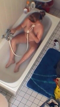 Sexy chubby amateur fucks herself in the bathroom