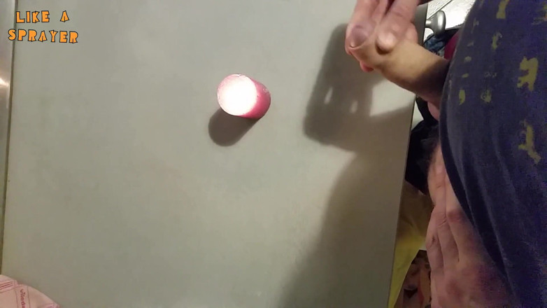 Like a sprayer: Candle cumshot by handjob