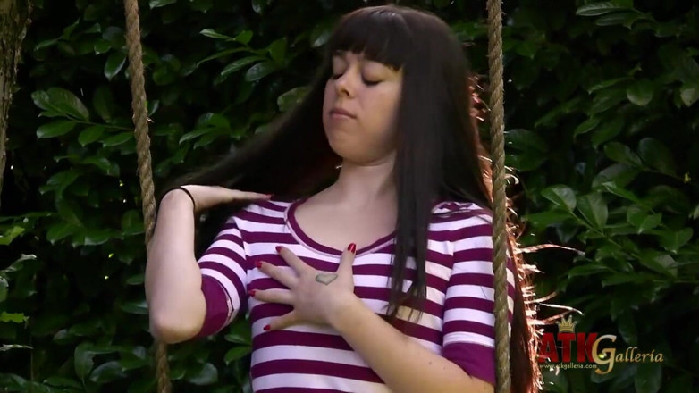 ATK Fans (Solo): Dark haired teen Erin Taylor fingers her pussy outdoors before...