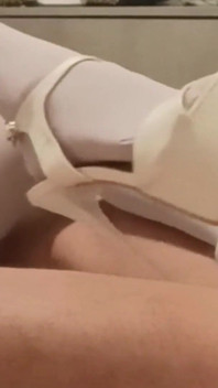 MILF in Pantyhose and Heels Gives a Footjob