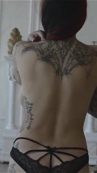 Plumpy tattooed MILF is dancing striptease