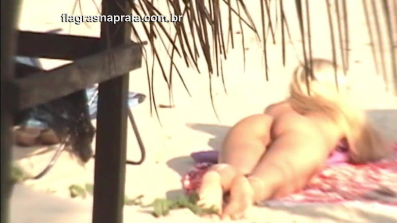 Amateurs videos: Wonderful blonde and brunette take sunbathing naked on a beach...