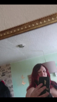 Showing off in a cool lab coat in front of the mirror