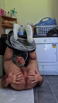 Hairy Bear Doing Laundry