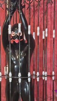 Imprisoned Rubber Slut Has to Give a Blowjob
