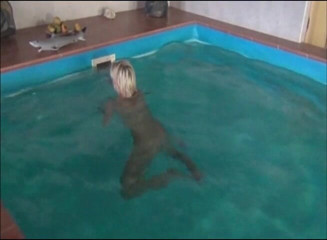 Flash Model Amateurs: Blonde girl is swimming in the pool before taking a...