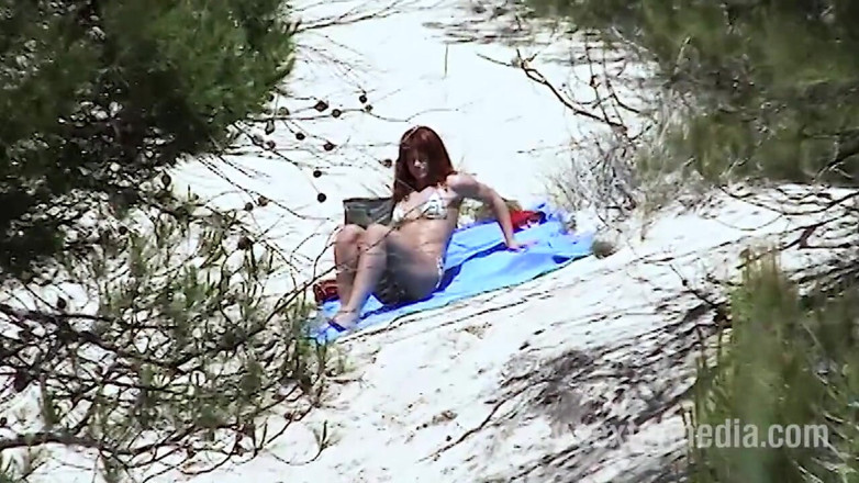 Sextermedia by Pete: Redhead beauty dildoing pussy on the sandy beach