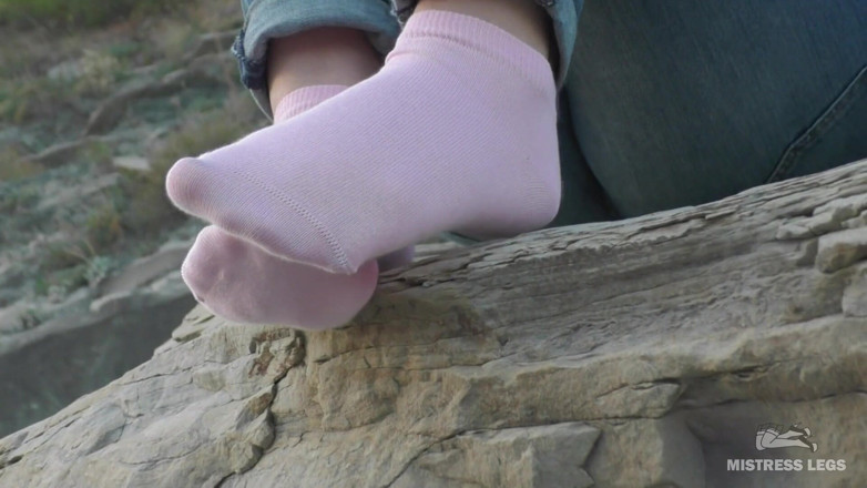 Mistress Legs: Sexy feet in pink ankle socks on the seashore