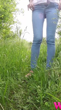 Full Bladder Skinny Brunette Pissing in the Woods in the Tall Grass