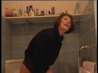 Lucky Cooch: Woman pissing in the bathroom