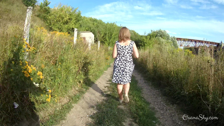 MILF Oxana: Flashing and naughty fun at the riverside