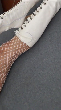 Perfect-assed MILF in High-heeled Boots and Fishnet Stockings