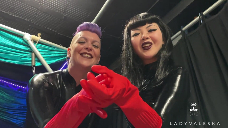 Lady Valeska: Latex Dommes invite you to suck their huge strap ons