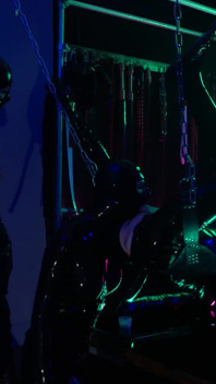 The rubber Domme the giant dildo and the gimp