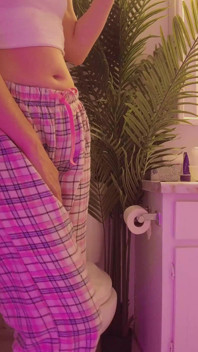 Emily pissing in the bathroom