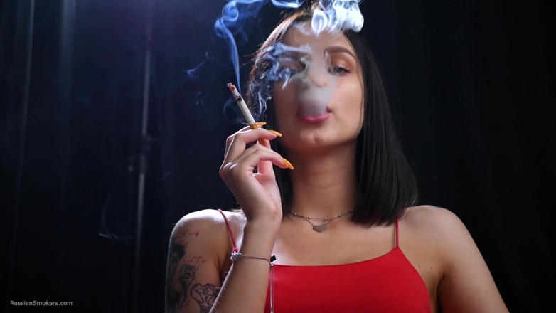 Russian Smokers: Sexy Lady in Red Is Smoking Two 100mm Reds