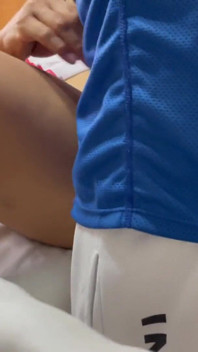 An injured tennis player gets hands on help from the nurse