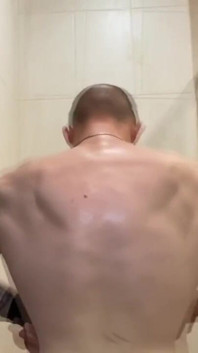 Alpha Shows off His Back Muscles