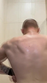 Alpha Shows off His Back Muscles