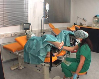 Rubber & Clinic Studio - 1ATOYS: Nurse in green surgery outfit