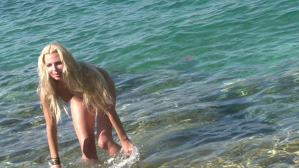 Cryptostudios: Lovely blonde MILF posing naked on the beach