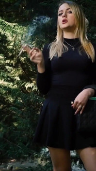 Hot Blonde Babe Smoking One Black Cigarettes in Nature